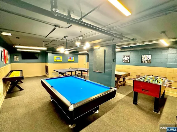 a room with furniture pool table tennis table