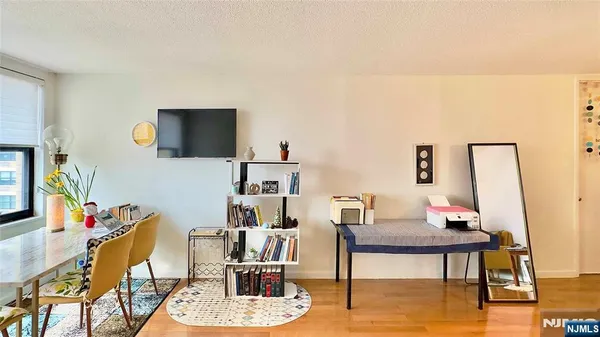 a view of a livingroom with furniture and a flat screen tv