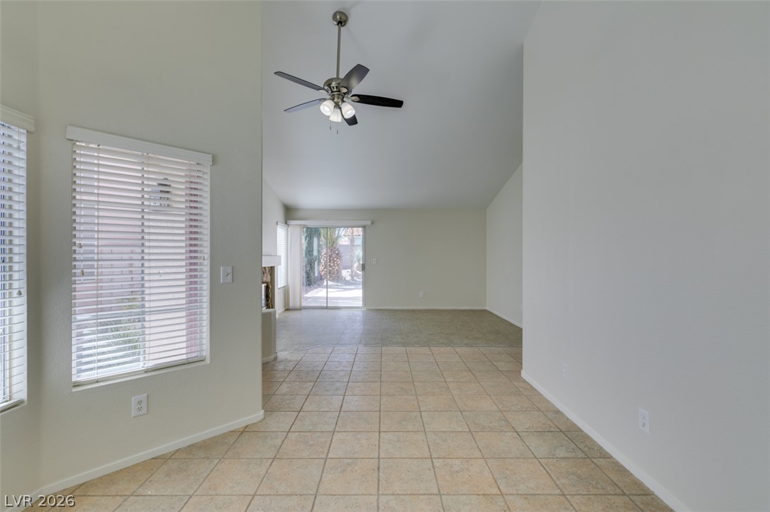 307 Cavalla Street Henderson, NV 89074 - Photo 20 of 44 Vast vaulted ceilings and tiled flooring flow into an inviting outdoor patio.