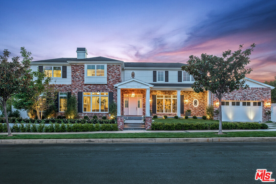 557 Chapala Drive Pacific Palisades, CA 90272 - Photo 1 of 48 a front view of a house with a garden
