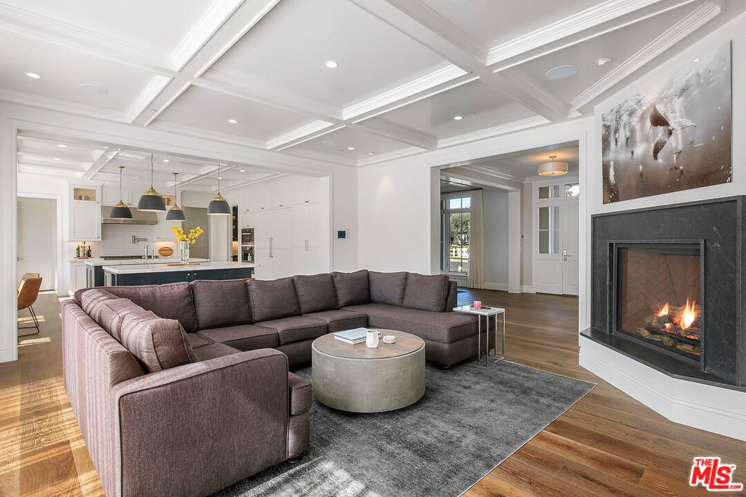 557 Chapala Drive Pacific Palisades, CA 90272 - Photo 17 of 48 a living room with furniture and a fireplace