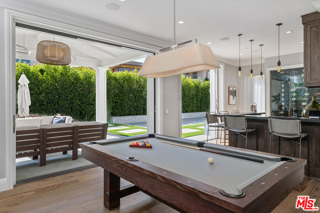 557 Chapala Drive Pacific Palisades, CA 90272 - Photo 21 of 48 a room with furniture pool table wooden floor and window