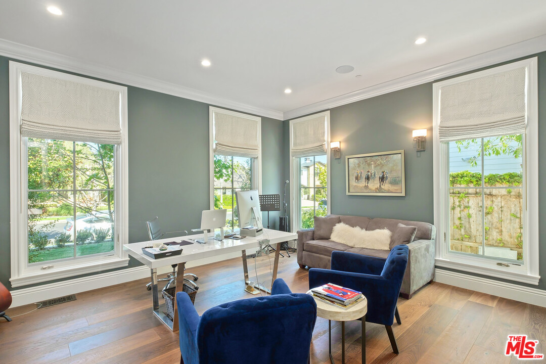 557 Chapala Drive Pacific Palisades, CA 90272 - Photo 24 of 48 a living room with furniture and a window
