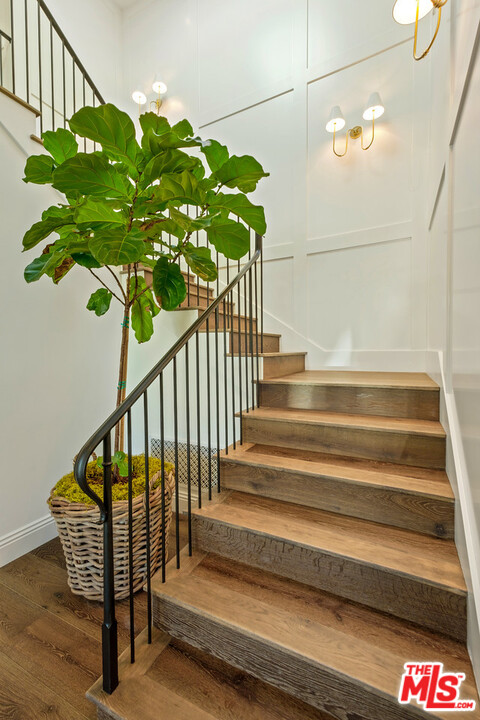 557 Chapala Drive Pacific Palisades, CA 90272 - Photo 25 of 48 a view of staircase with wooden floor