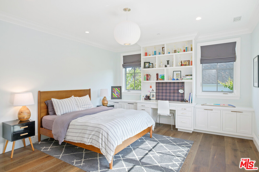 557 Chapala Drive Pacific Palisades, CA 90272 - Photo 26 of 48 a bedroom with a bed furniture and window