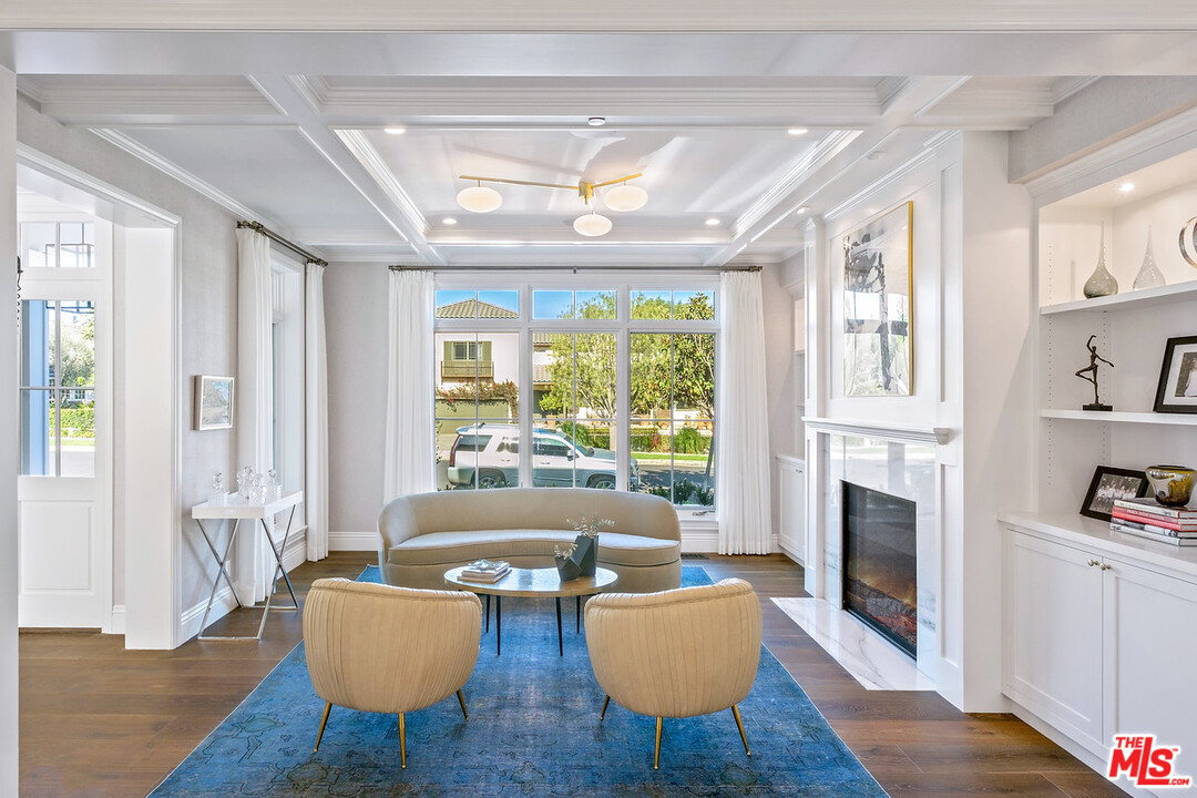 557 Chapala Drive Pacific Palisades, CA 90272 - Photo 37 of 48 a living room with furniture fireplace and a window