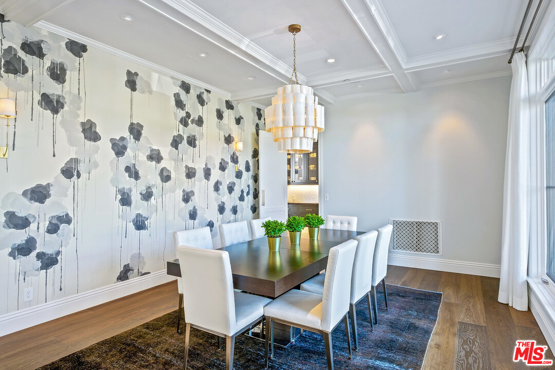 557 Chapala Drive Pacific Palisades, CA 90272 - Photo 38 of 48 a view of a dining room with furniture window and wooden floor