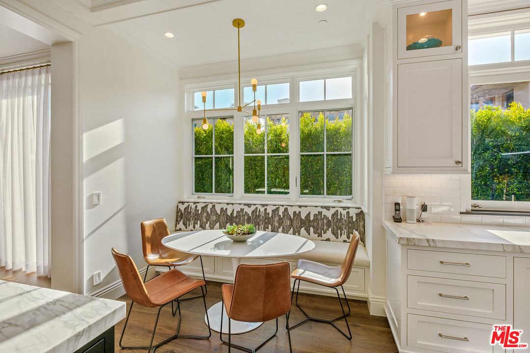 557 Chapala Drive Pacific Palisades, CA 90272 - Photo 42 of 48 a view of a dining room with furniture and window