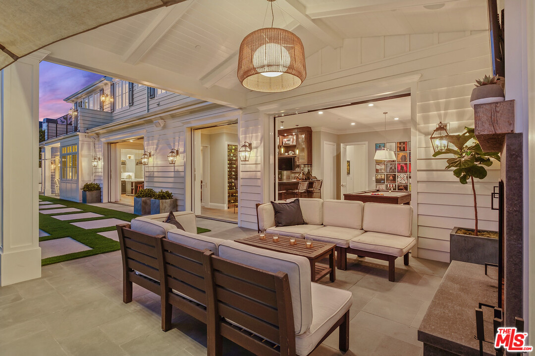 557 Chapala Drive Pacific Palisades, CA 90272 - Photo 48 of 48 a living room with furniture and a chandelier