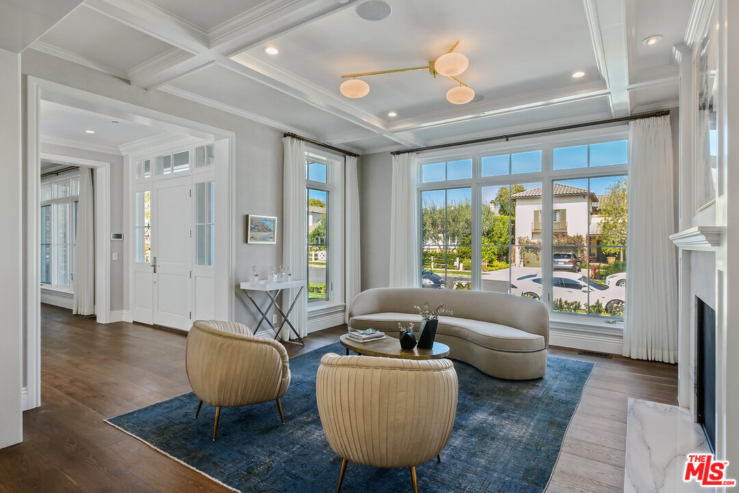 557 Chapala Drive Pacific Palisades, CA 90272 - Photo 8 of 48 a living room with furniture and a large window