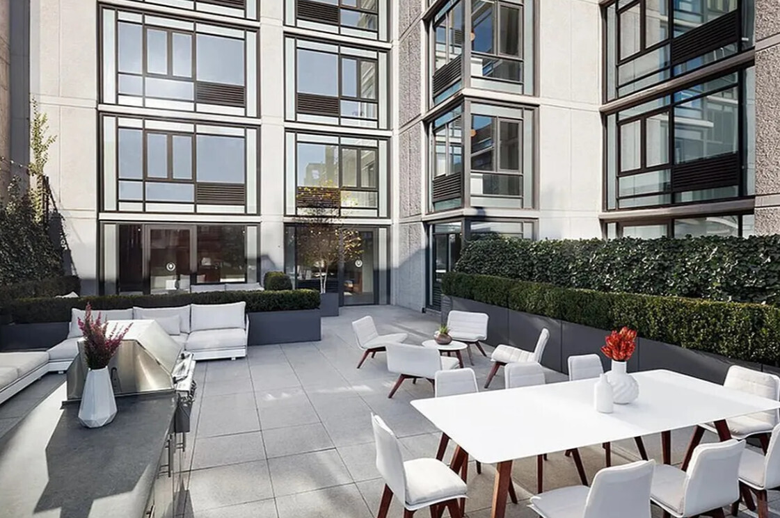 385 1st Avenue, Unit 20A Manhattan, NY 10010 - Photo 3 of 7 a view of a patio filled with furniture