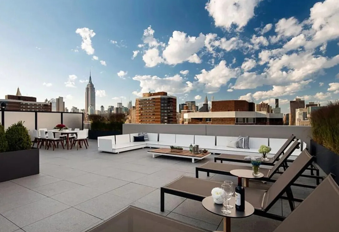 385 1st Avenue, Unit 20A Manhattan, NY 10010 - Photo 4 of 7 a view of a terrace with seating area and barbeque oven