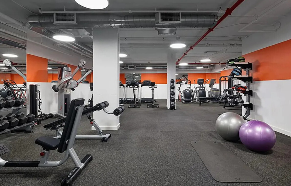 385 1st Avenue, Unit 20A Manhattan, NY 10010 - Photo 5 of 7 a room with gym equipment