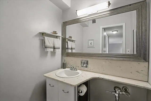 a bathroom with a sink and a mirror