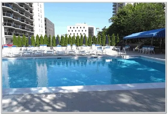 a view of swimming pool with outdoor seating