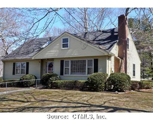 20 Oakwood Road Old Saybrook, CT 06475 - Photo 1 of 1 a front view of a house with garden
