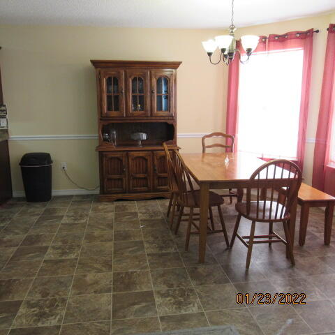 5816 Ester Terrace Crestview, FL 32539 - Photo 14 of 29 a view of a dining room with furniture