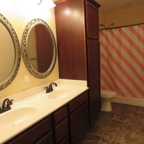 5816 Ester Terrace Crestview, FL 32539 - Photo 18 of 29 a bathroom with a sink and a mirror