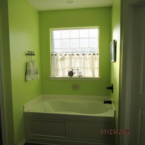 5816 Ester Terrace Crestview, FL 32539 - Photo 22 of 29 a bathroom with a bathtub and a window