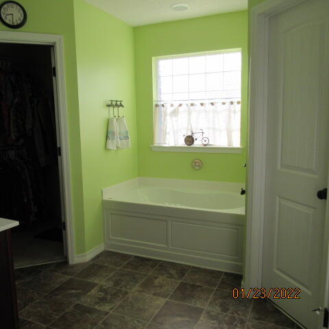 5816 Ester Terrace Crestview, FL 32539 - Photo 23 of 29 a bathroom with a bathtub and a shower