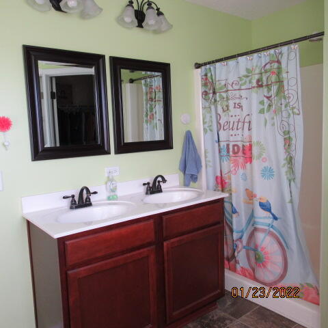 5816 Ester Terrace Crestview, FL 32539 - Photo 25 of 29 a bathroom with a sink and a mirror