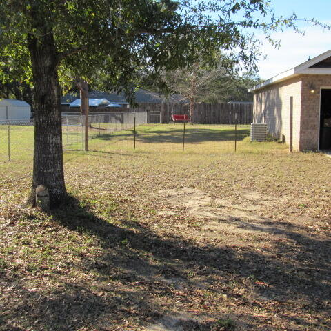 5816 Ester Terrace Crestview, FL 32539 - Photo 7 of 29 a view of a yard with large trees