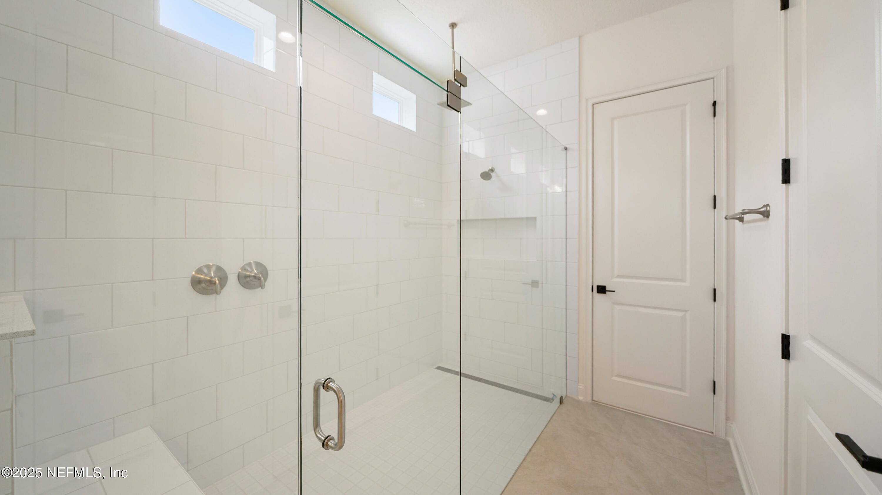 3137 Spiro Circle Jacksonville, FL 32246 - Photo 11 of 84 a bathroom with a shower and a glass door