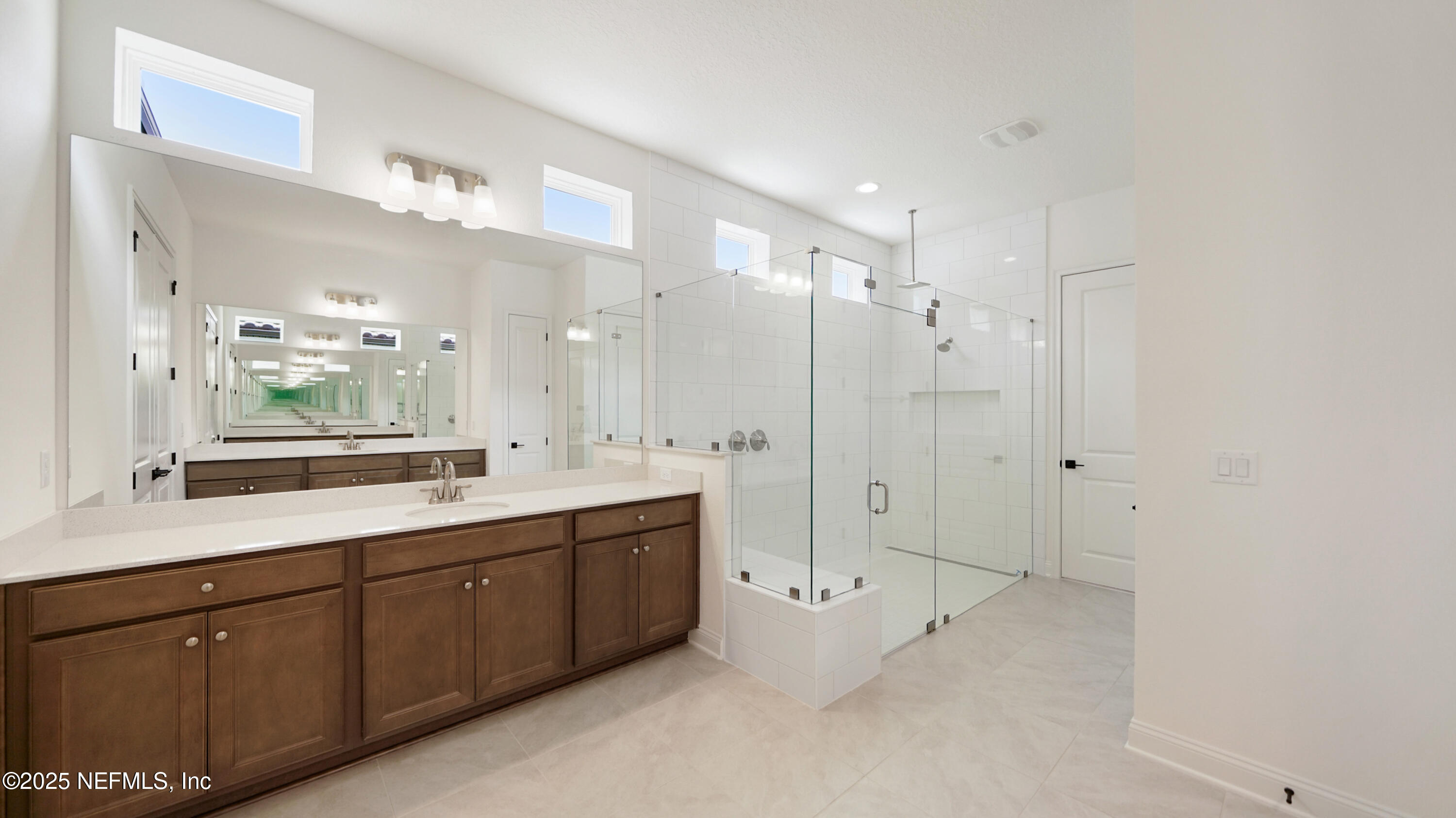 3137 Spiro Circle Jacksonville, FL 32246 - Photo 26 of 84 a spacious bathroom with a double vanity sink mirror and shower