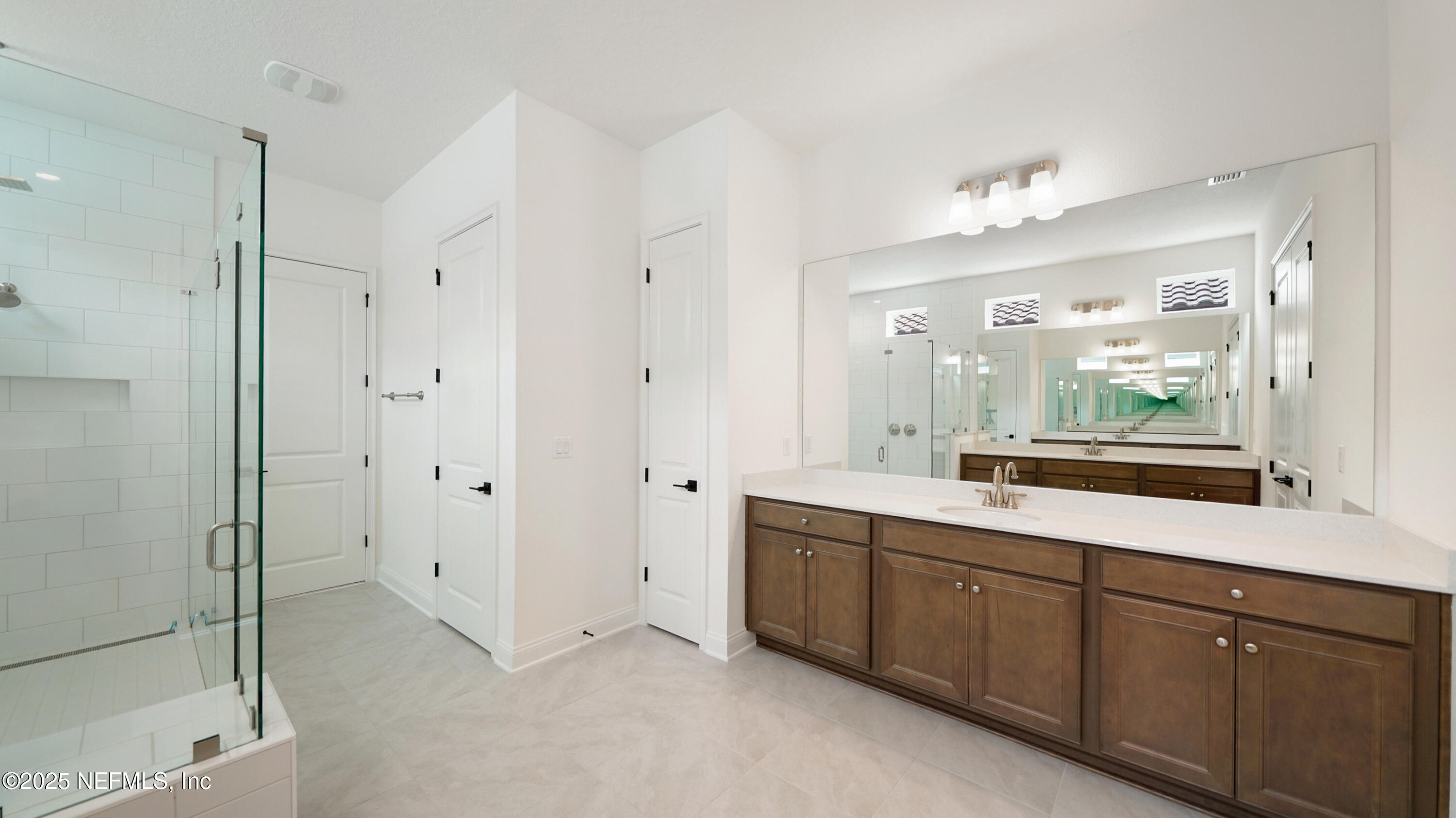 3137 Spiro Circle Jacksonville, FL 32246 - Photo 27 of 84 a spacious bathroom with a double vanity sink mirror and double