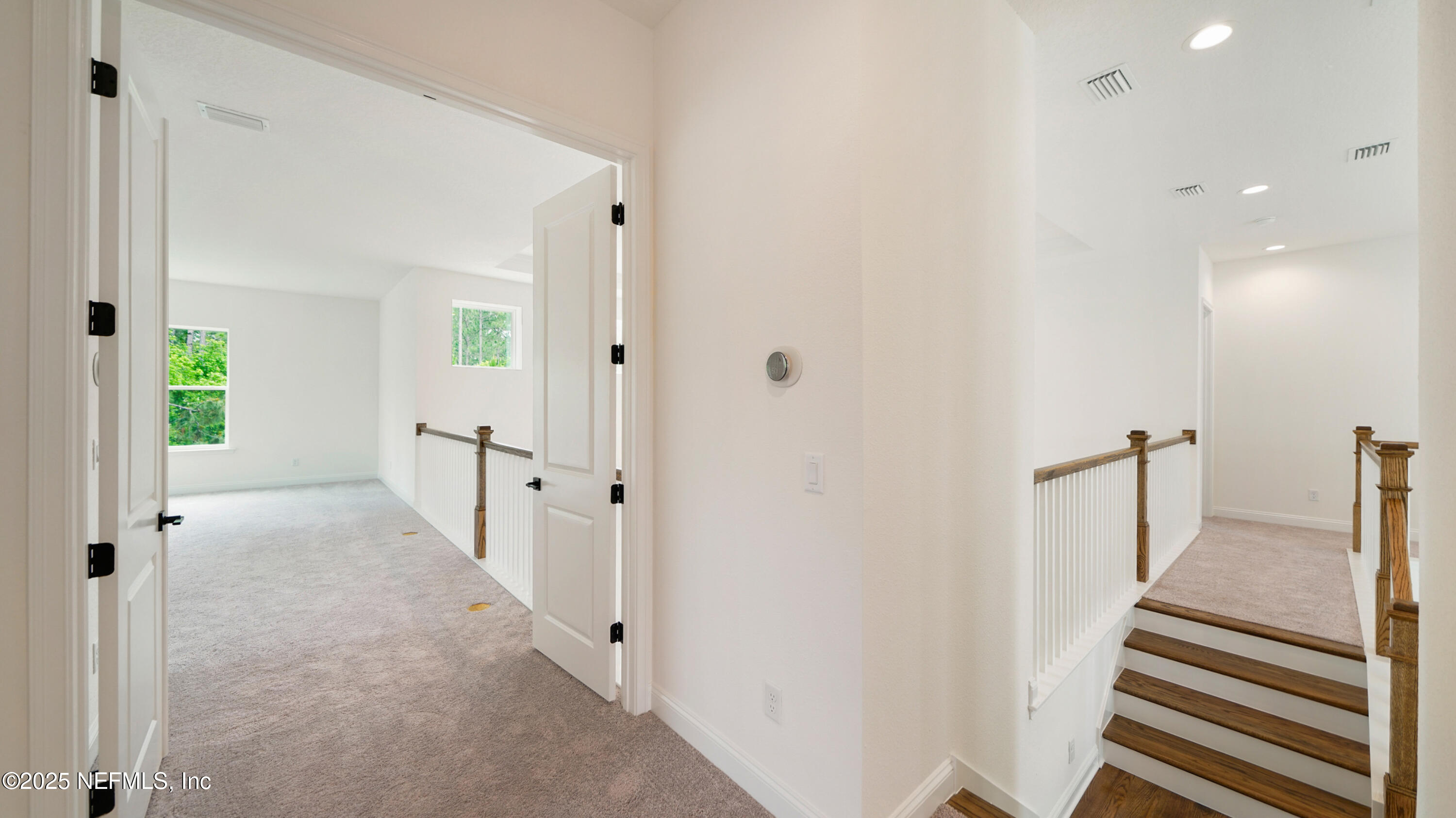 3137 Spiro Circle Jacksonville, FL 32246 - Photo 37 of 84 a view of a hallway with wooden floor and staircase