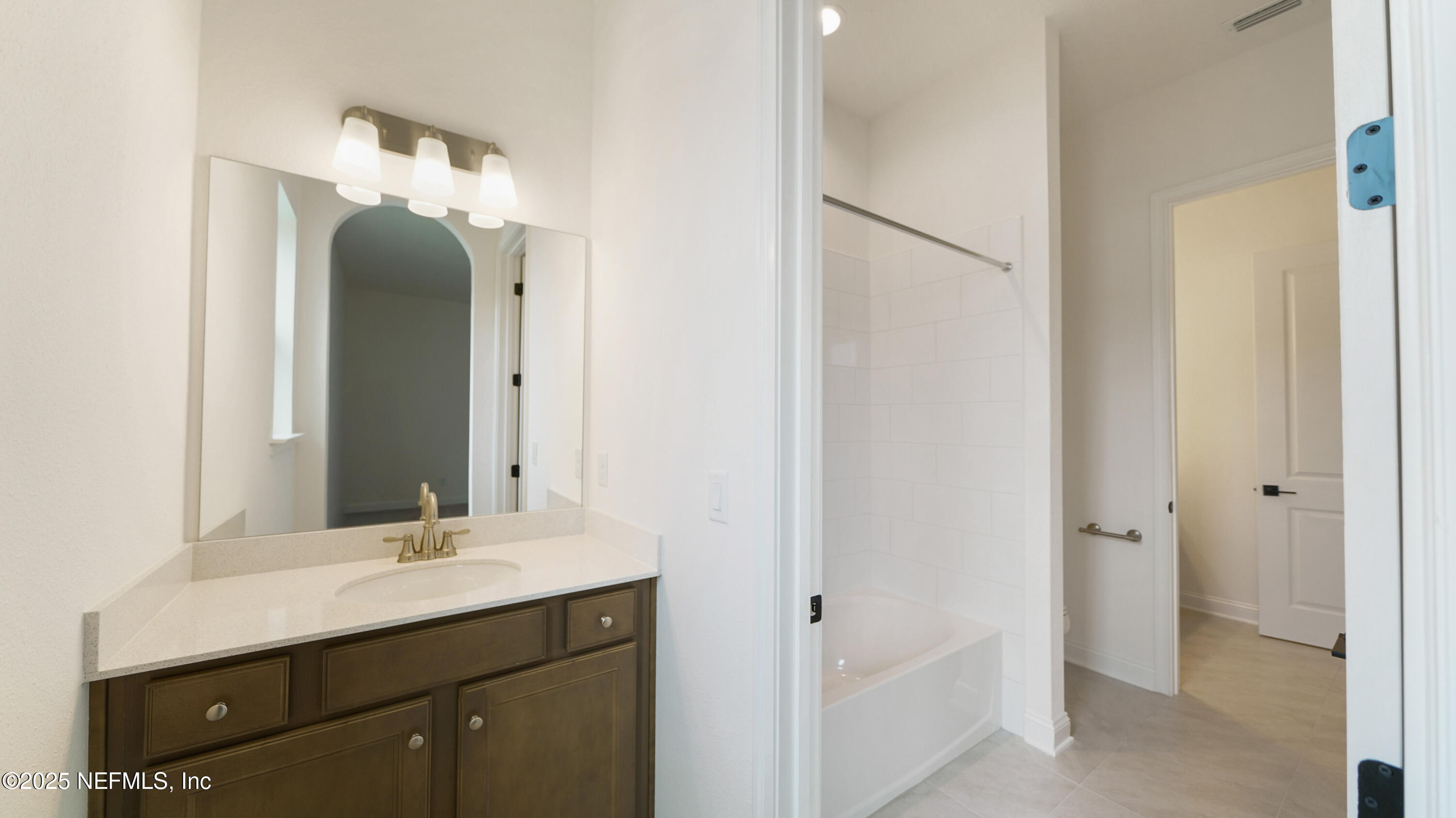 3137 Spiro Circle Jacksonville, FL 32246 - Photo 43 of 84 a bathroom with a double vanity sink and a mirror