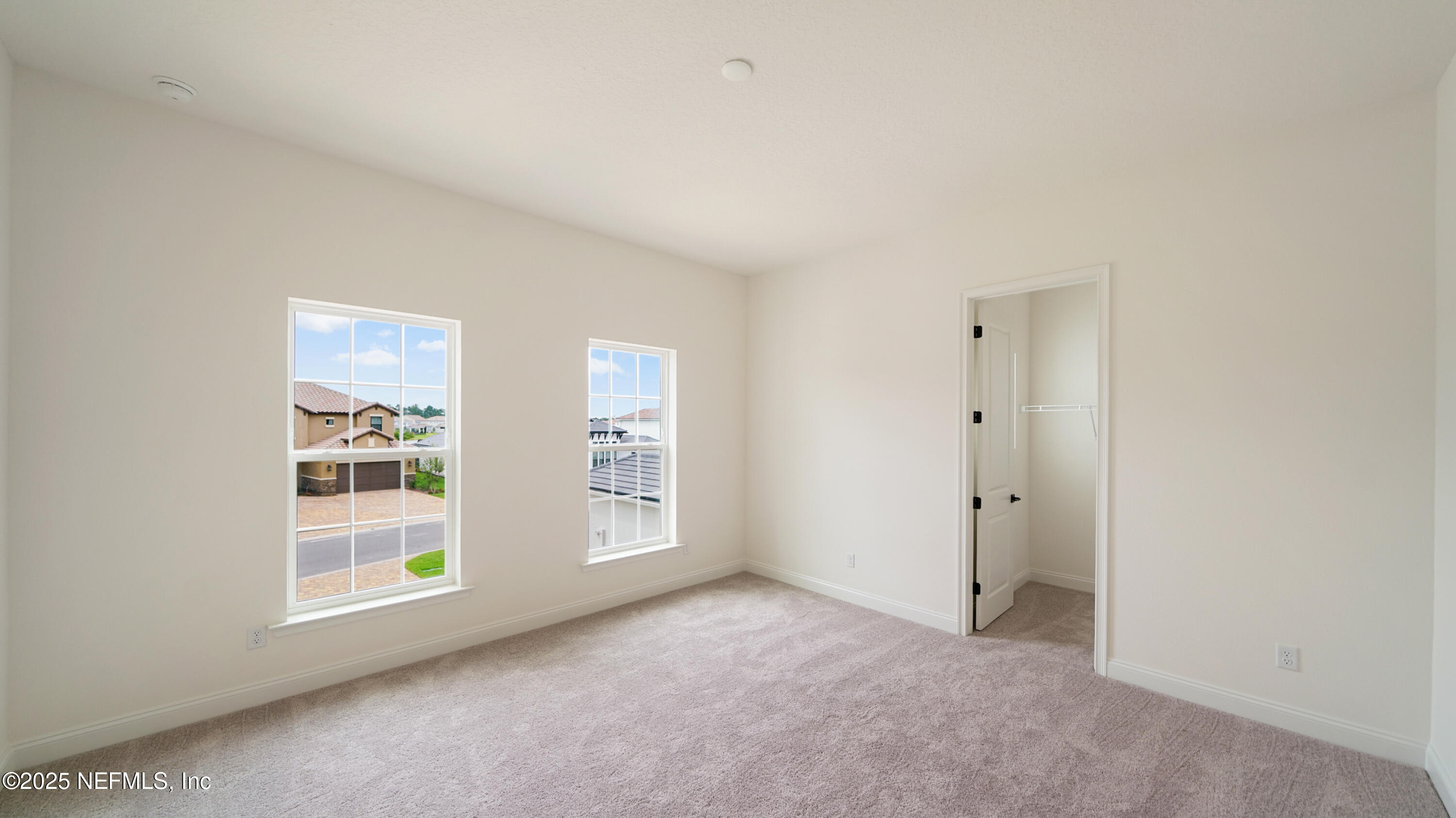 3137 Spiro Circle Jacksonville, FL 32246 - Photo 46 of 84 a view of a big room with windows and chandelier