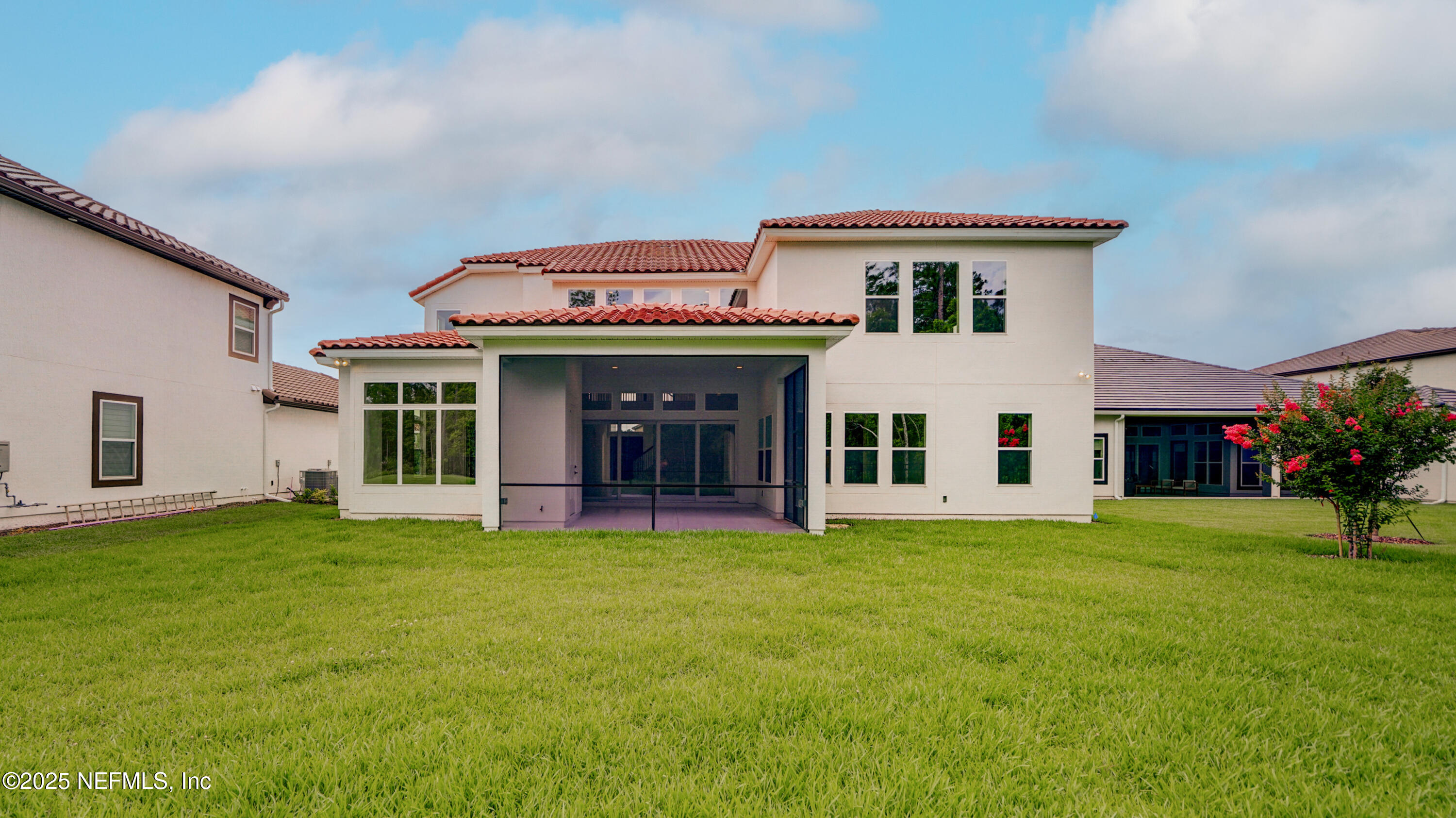 3137 Spiro Circle Jacksonville, FL 32246 - Photo 68 of 84 a view of a white house with a big yard and potted plants