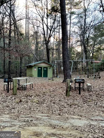 a view of a table and chairs in the yard