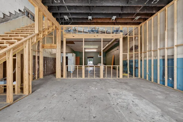 a view of an empty room with stairs
