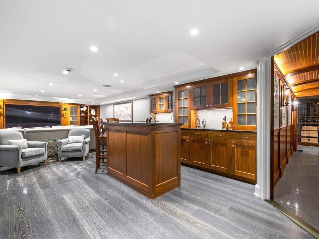 19 Radcliffe Road Wellesley, MA 02482 - Photo 15 of 21 a kitchen with stainless steel appliances granite countertop a refrigerator and a stove top oven