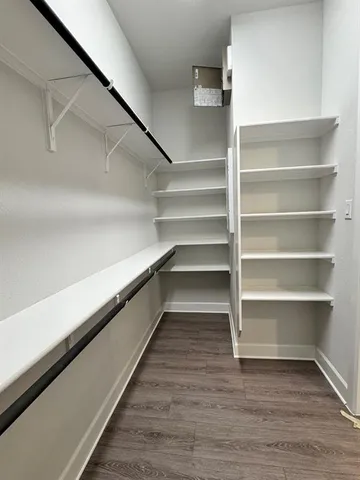 a hallway with view of a living room