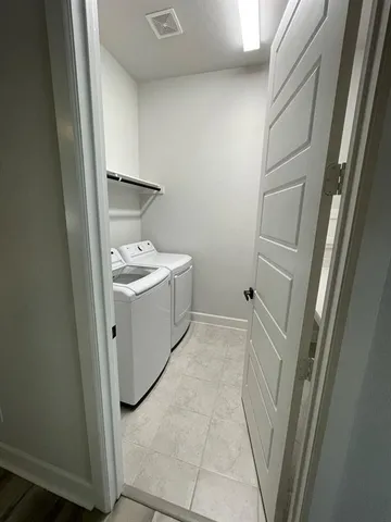 a bathroom with a sink and mirror with toilet
