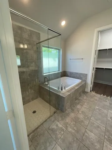 a bathroom with a shower and a sink