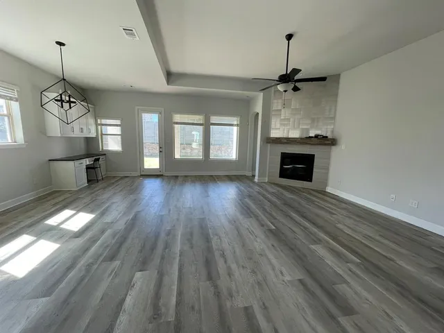 a view of a kitchen with a stove cabinets and a wooden floor