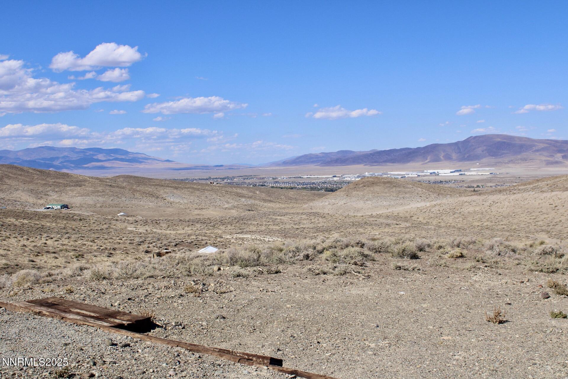 7785 Desert Shadows Lane Fernley, NV 89408 - Photo 3 of 21 a view of an ocean beach and mountain