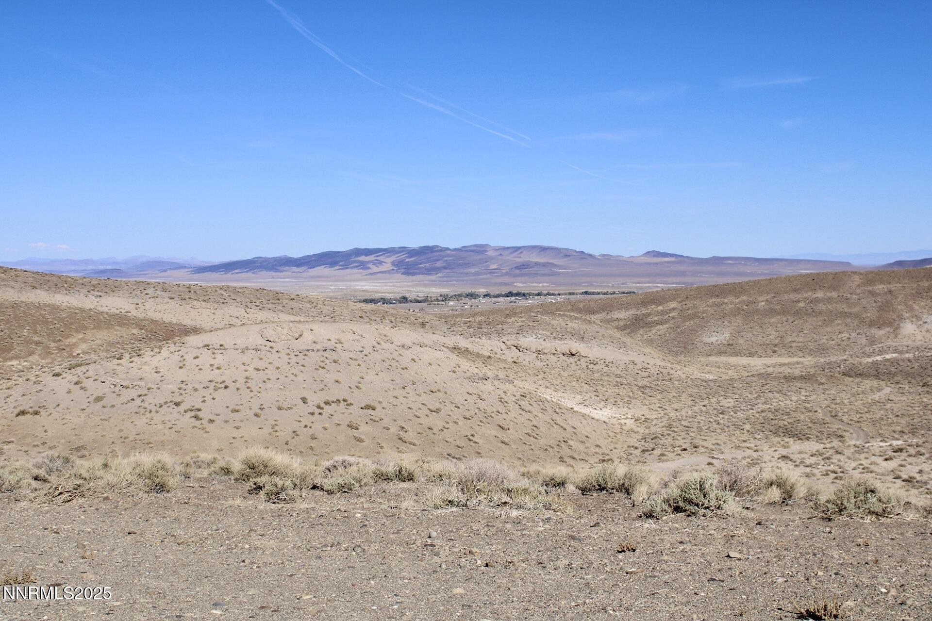 7785 Desert Shadows Lane Fernley, NV 89408 - Photo 5 of 21 a view of an outdoor space and mountain view
