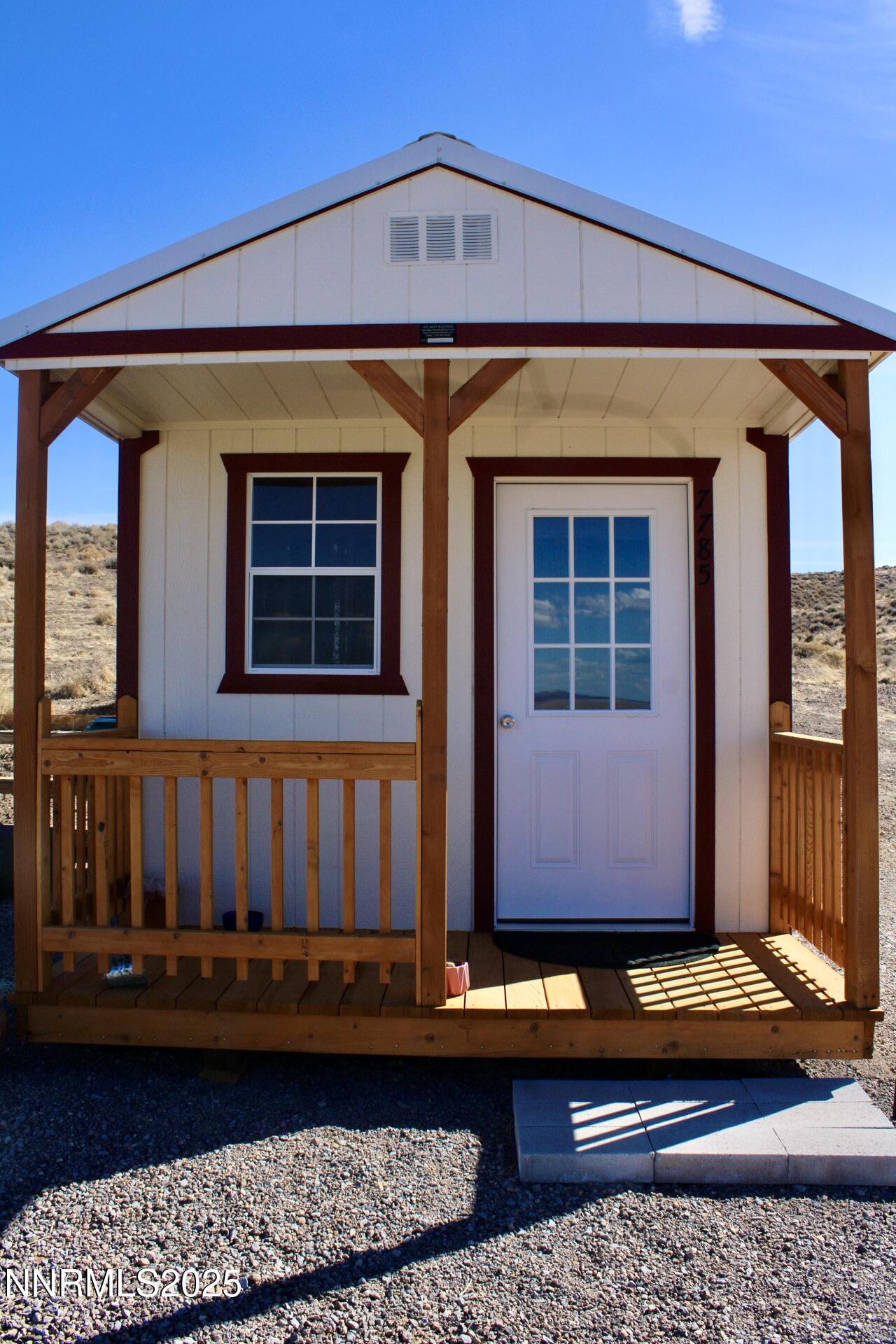 7785 Desert Shadows Lane Fernley, NV 89408 - Photo 9 of 21 a view of building with glass windows