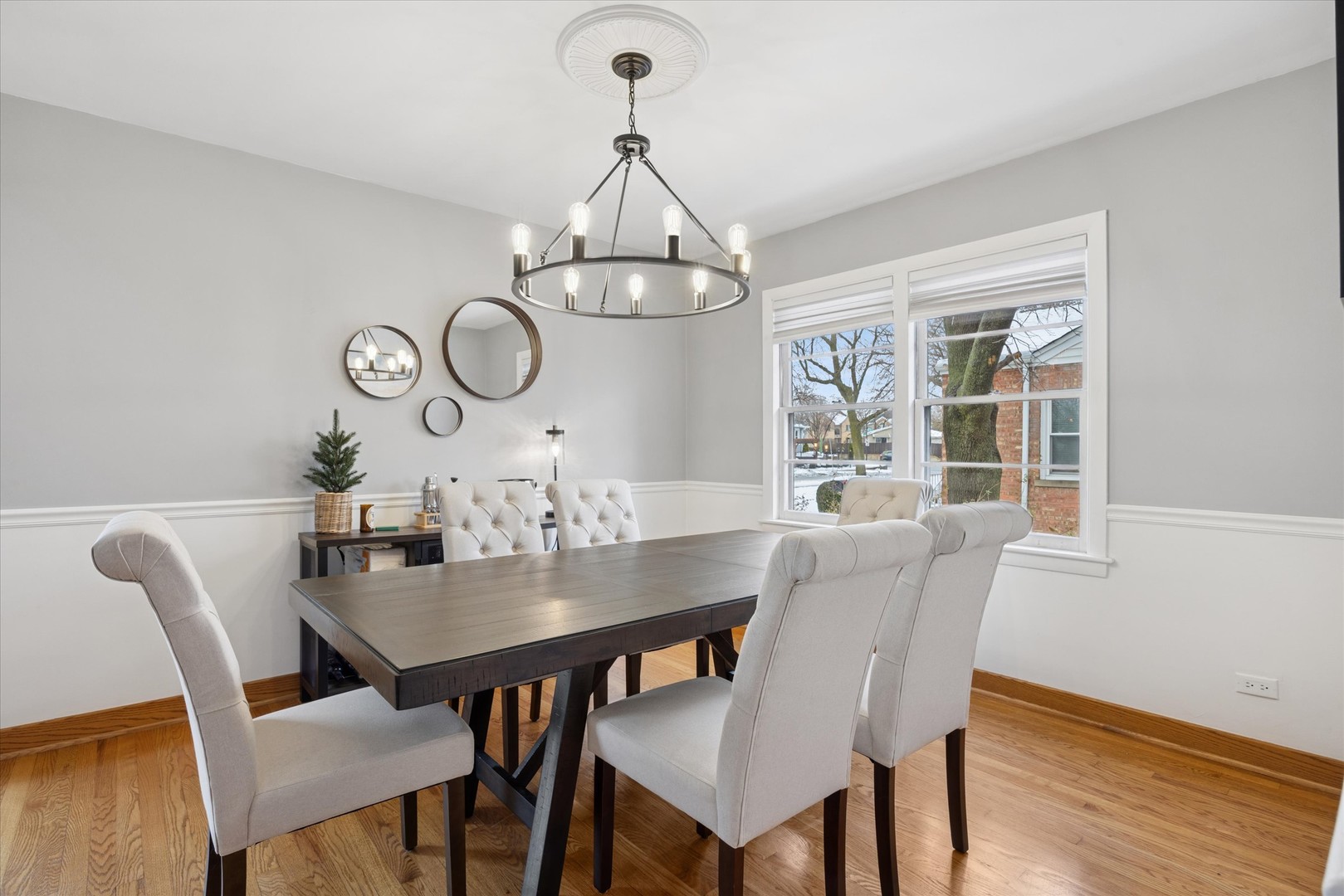 309 Clinton Avenue Elmhurst, IL 60126 - Photo 11 of 33 a view of a dining room with furniture a chandelier and wooden floor