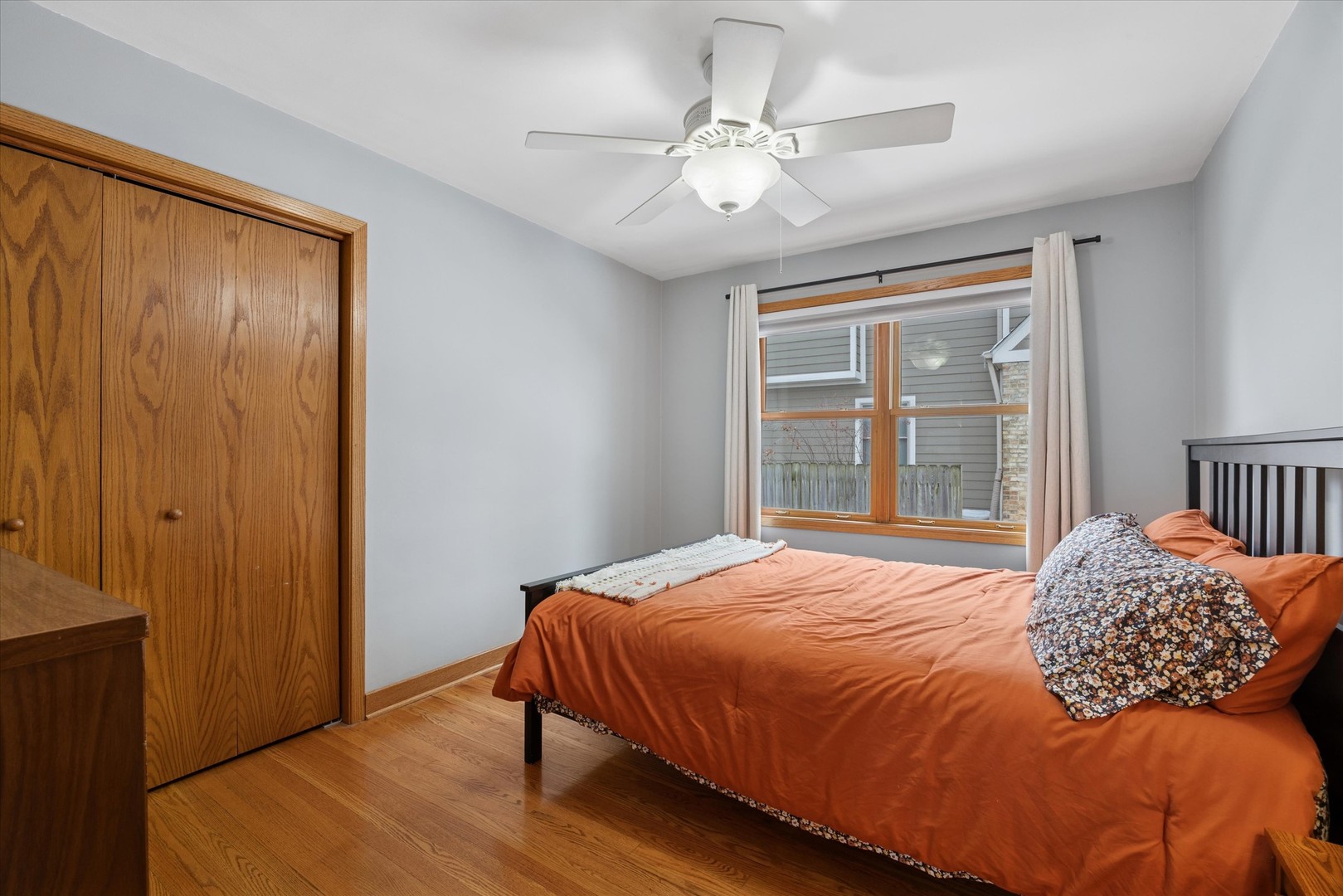 309 Clinton Avenue Elmhurst, IL 60126 - Photo 13 of 33 a bedroom with a large bed and a window