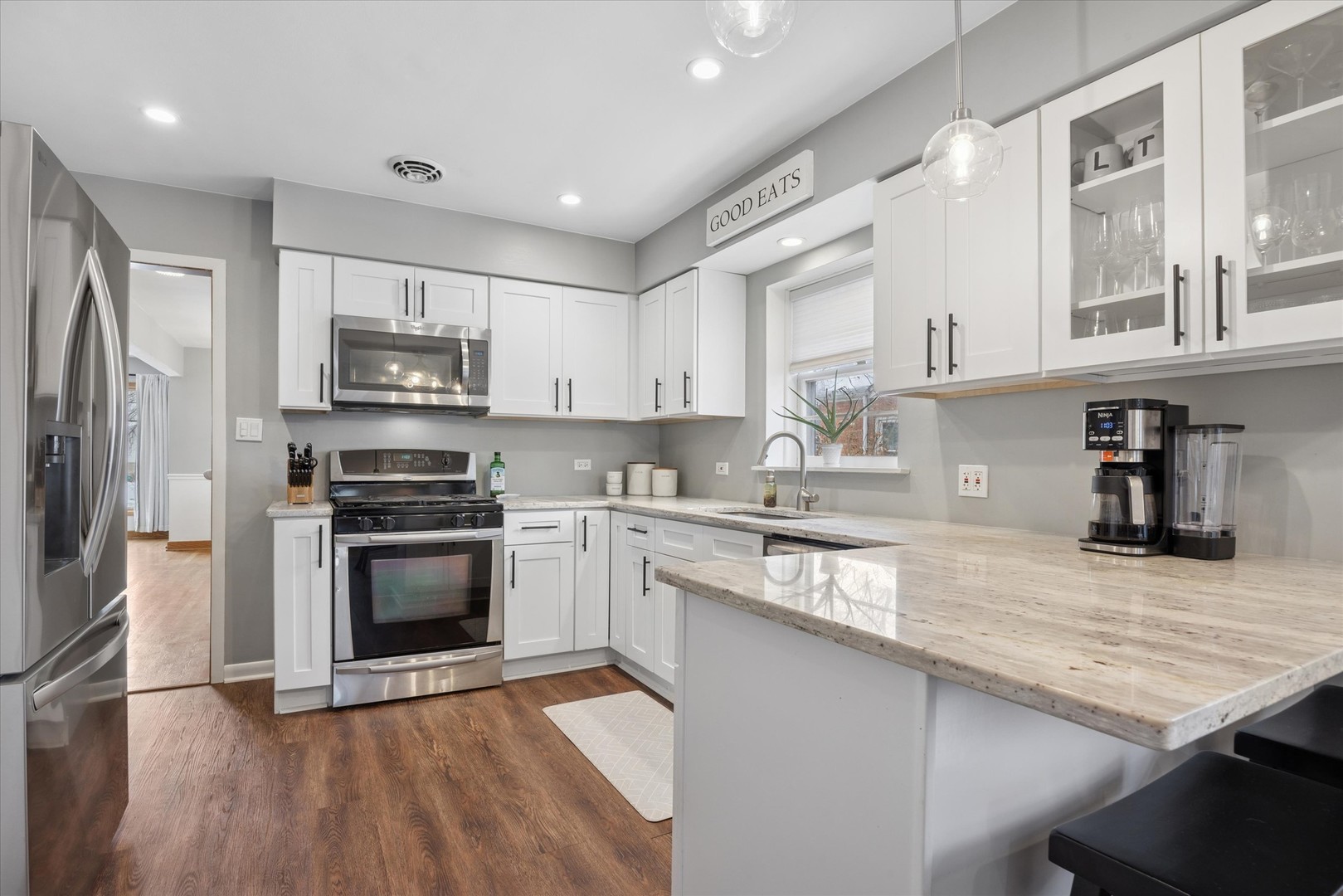 309 Clinton Avenue Elmhurst, IL 60126 - Photo 15 of 33 a kitchen with stainless steel appliances granite countertop a stove a sink and a refrigerator