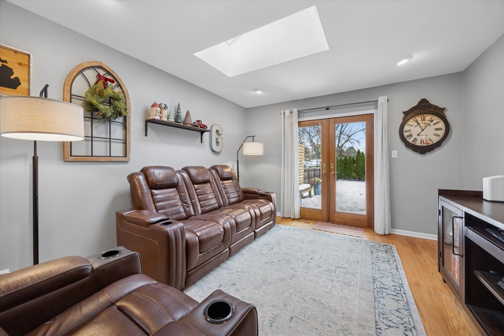 309 Clinton Avenue Elmhurst, IL 60126 - Photo 20 of 33 a living room with furniture a clock and a window