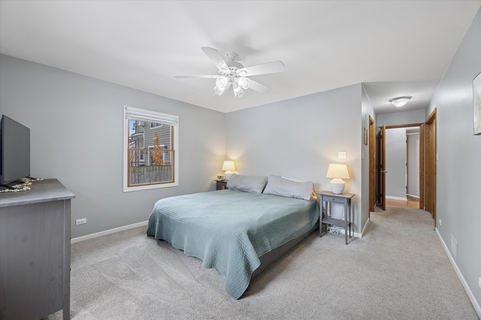309 Clinton Avenue Elmhurst, IL 60126 - Photo 25 of 33 a bedroom with a bed and a chandelier