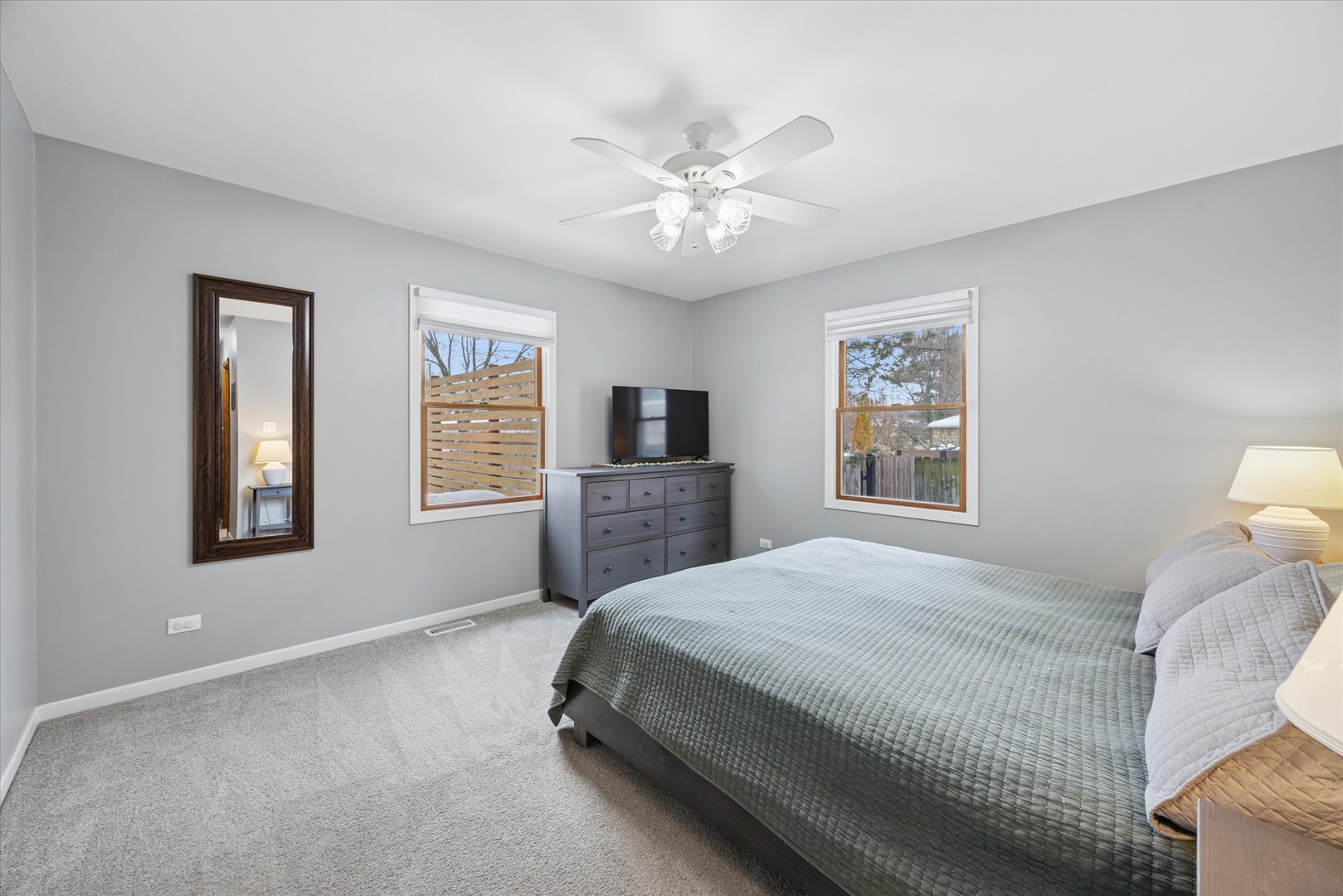 309 Clinton Avenue Elmhurst, IL 60126 - Photo 26 of 33 a bedroom with a large bed and a window
