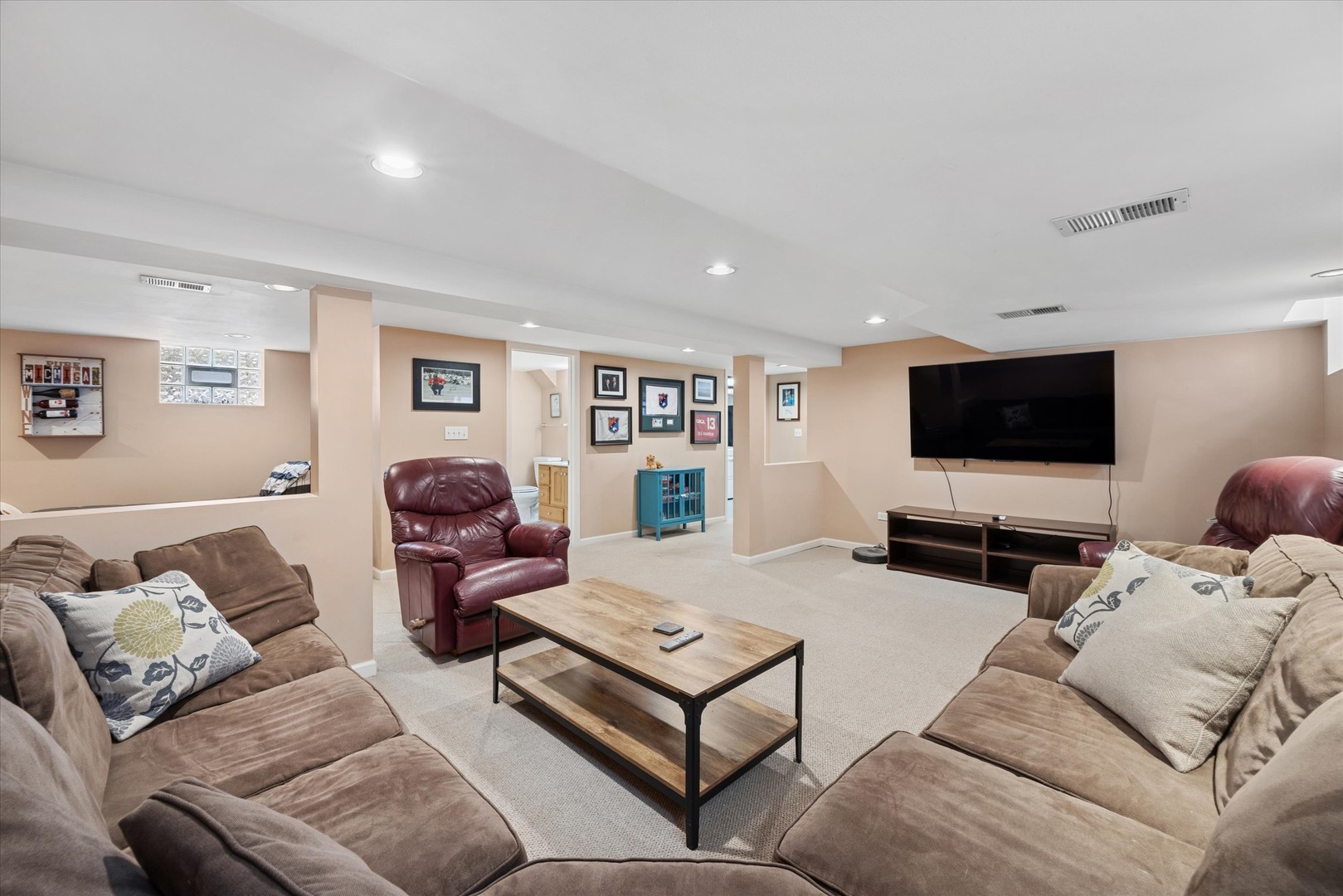 309 Clinton Avenue Elmhurst, IL 60126 - Photo 30 of 33 a living room with furniture and a flat screen tv